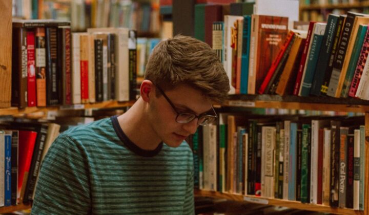 Student reading in library
