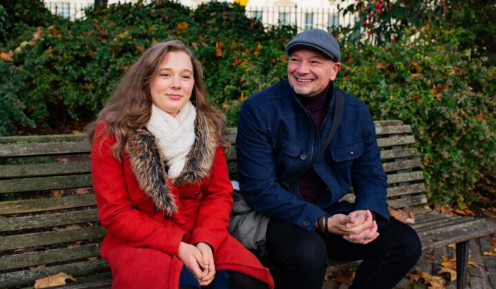 Father and daughter talking outside