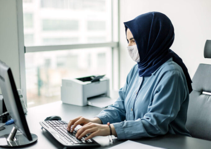 Young businesswoman in hijab working in quarantine