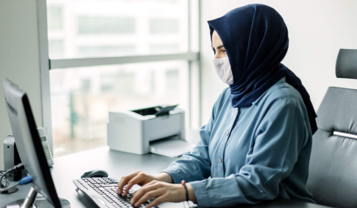 Young businesswoman in hijab working in quarantine