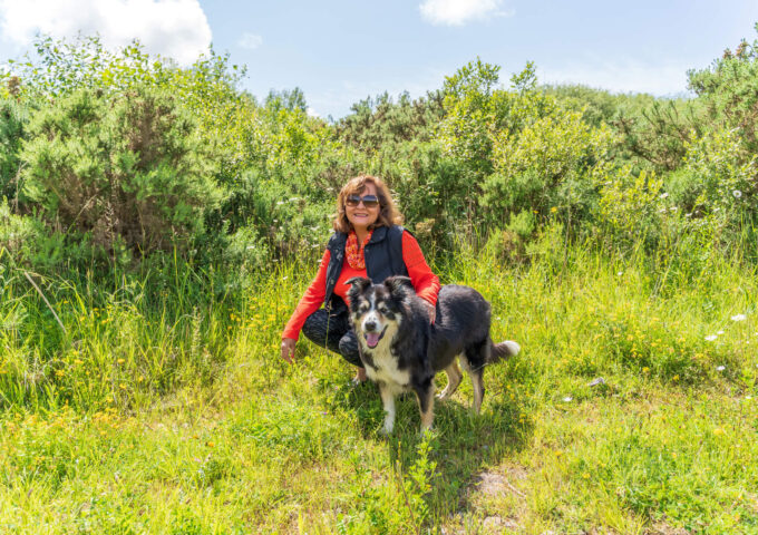 Women spending time in the countryside with her dog