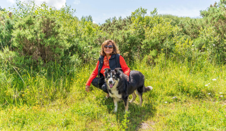 Women spending time in the countryside with her dog
