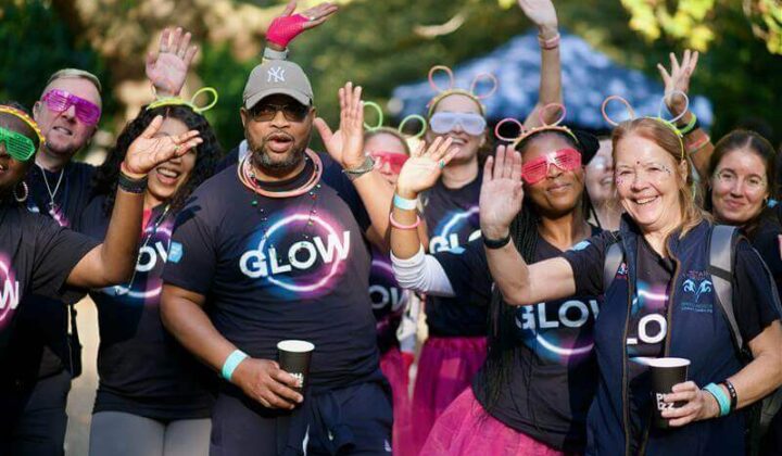 Group of happy people attending Glow night walk