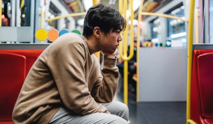 Man feeling anxious on the bus