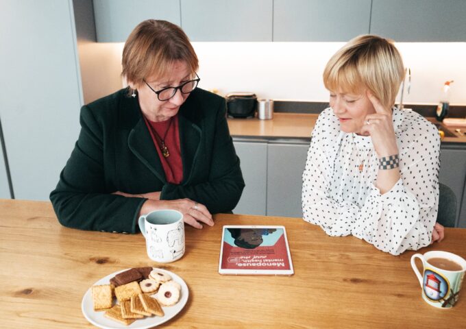 Two women talking in the kitchen