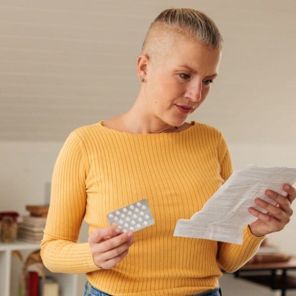 Female reading medication prescription