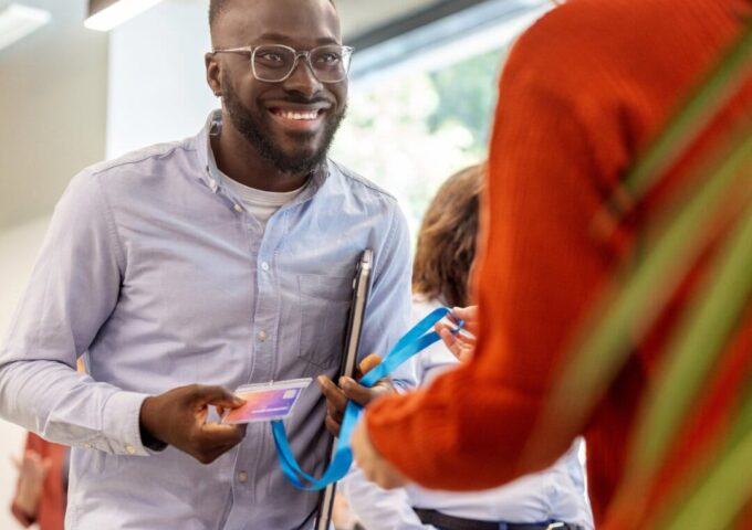 Male receiving his id pass