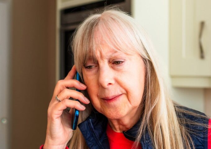Woman looking concerned on the phone