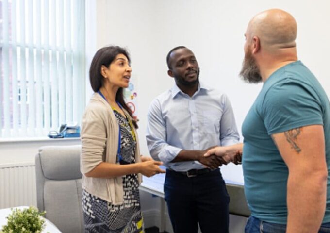 Man being welcomed at work