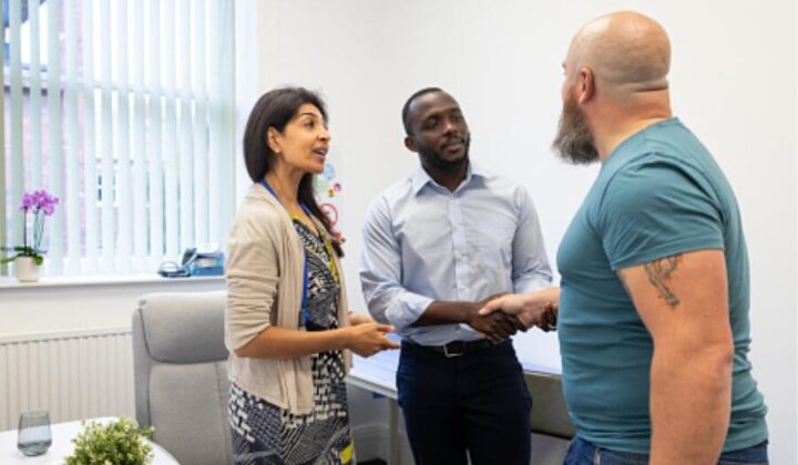 Man being welcomed at work