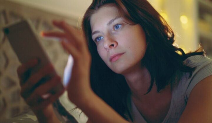 Young lady looking at her mobile