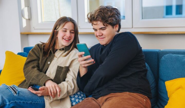 Two young people looking at mobile