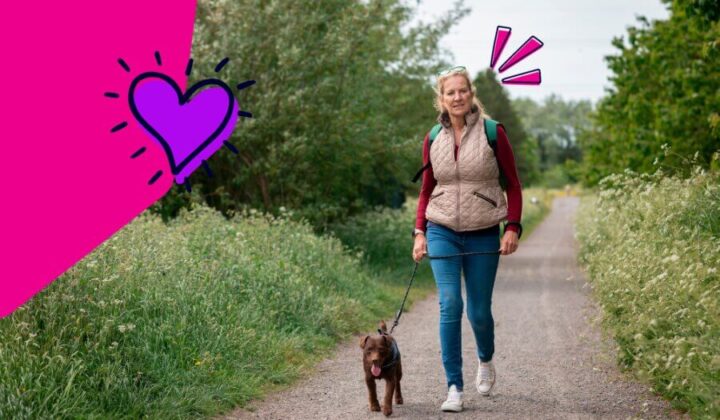 Lady walking her dog in the countryside