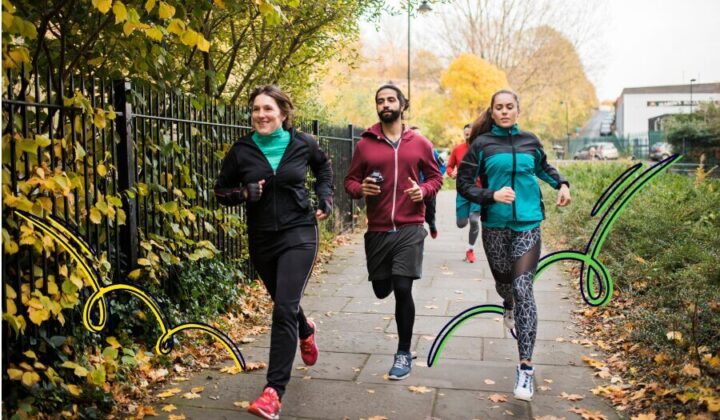 A group of people running in the park
