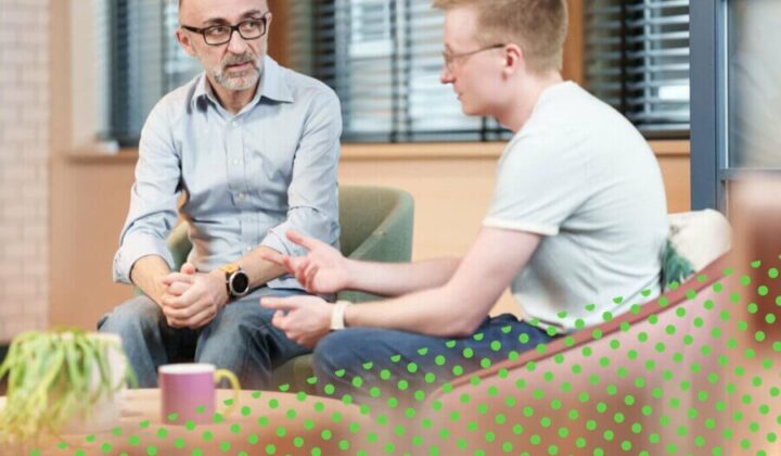 Two men talking to one another