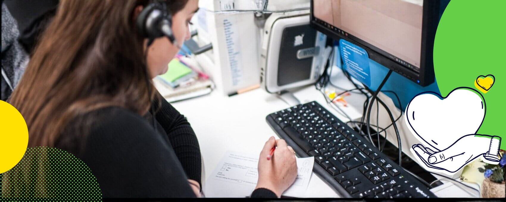 Person looking at laptop for information and speaking on the phone