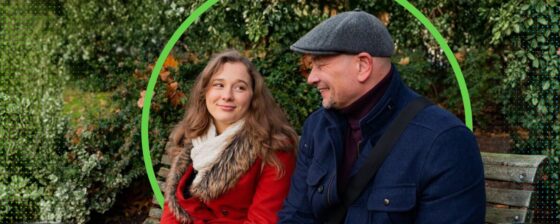 Dad and daughter chatting on a park bench