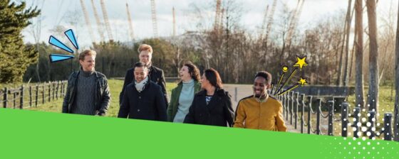 Group of adults walking in London chatting and laughing
