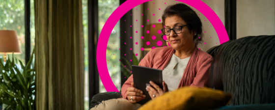 Lady at home looking at her tablet
